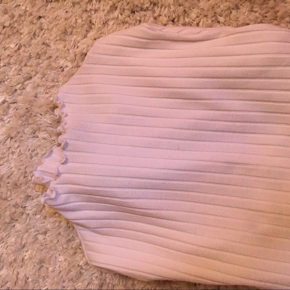 white ruffled mock neck top